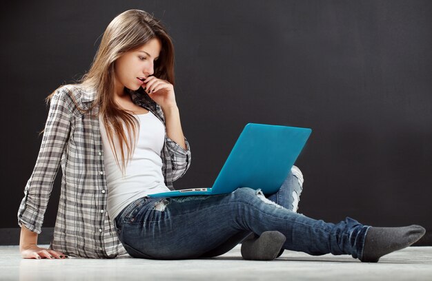 Beautiful girl look at laptop Free Photo
