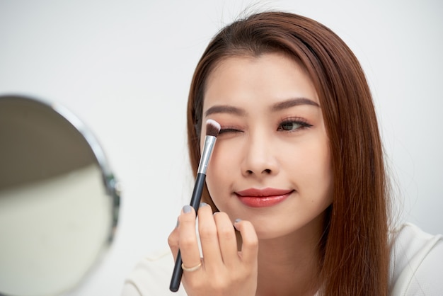 Premium Photo | Beautiful girl look at mirror with hand make.