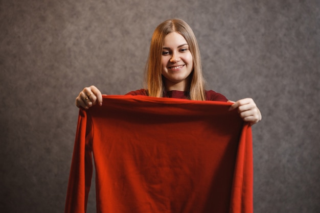 Premium Photo Beautiful Girl Tries On A Red Sweater