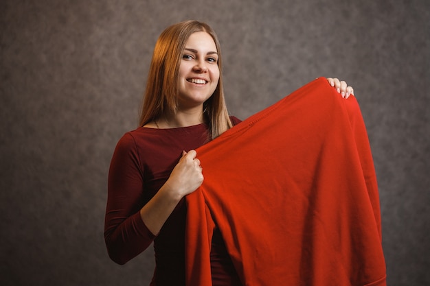 Premium Photo Beautiful Girl Tries On A Red Sweater