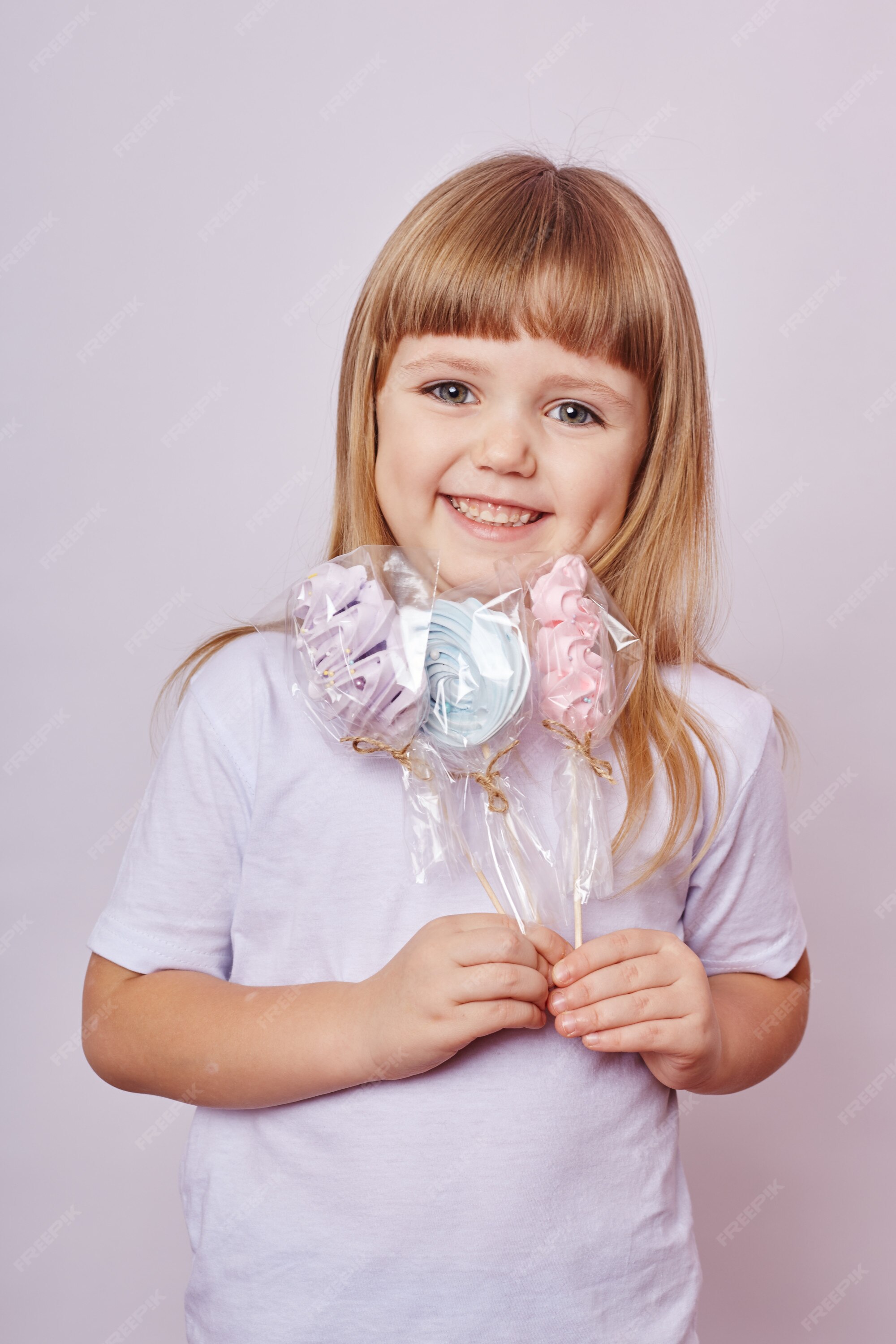 Premium Photo Beautiful Girl With Blond Hair Eats A Lollipop Round