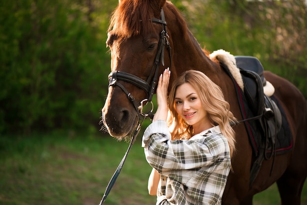 Premium Photo | Beautiful girl with her horse and beautiful warm sunset ...