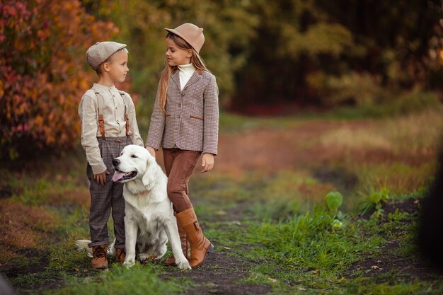 Premium Photo | Beautiful happy kids brother and sister are walking