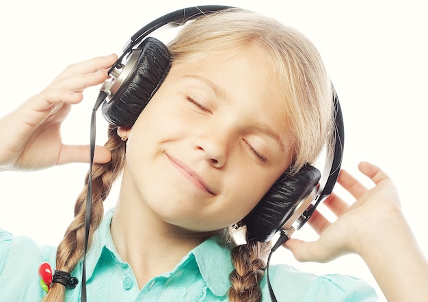 Premium Photo | Beautiful happy little girl with headphones. isolated ...