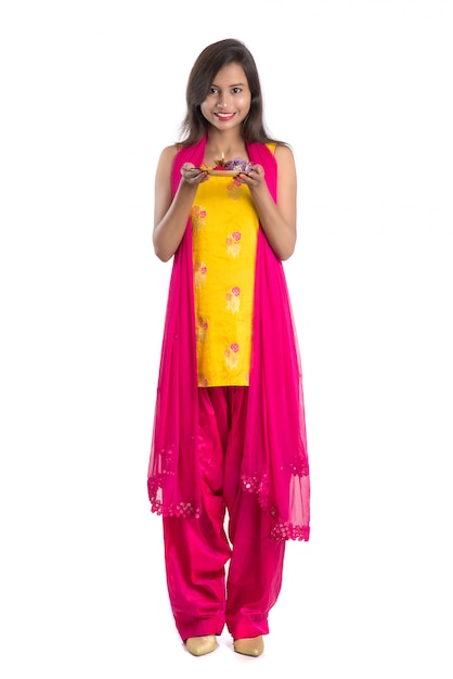 Premium Photo | Beautiful indian young girl holding pooja thali or ...