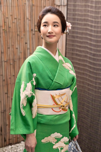 Beautiful japanese woman in a kimono outdoors Free Photo