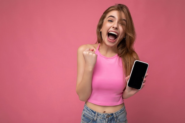 Premium Photo Beautiful Joyful Young Blonde Woman Wearing Pink Top