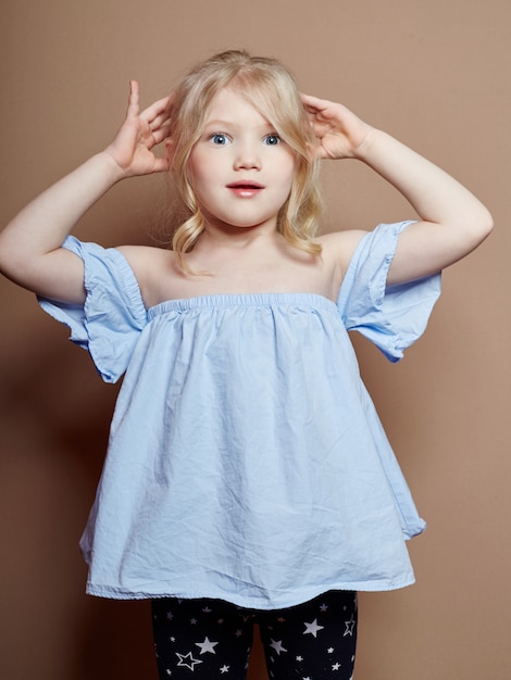 Beautiful Little Girl Blonde Curly Hair Emotions Premium Photo