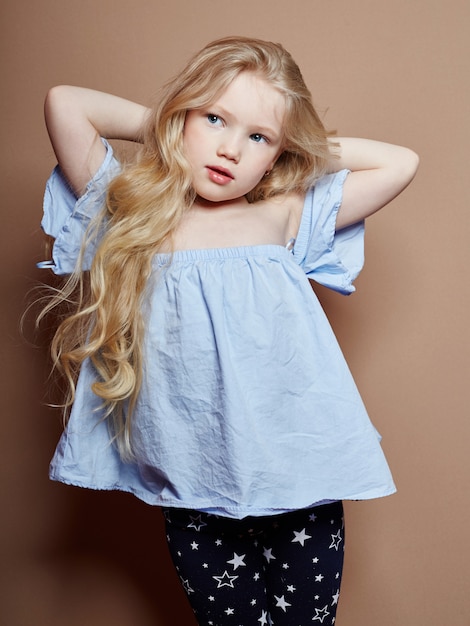 Premium Photo Beautiful Little Girl Blonde Curly Hair Emotions