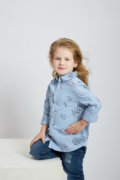 Premium Photo | Beautiful little girl smiles, child in autumn clothes ...