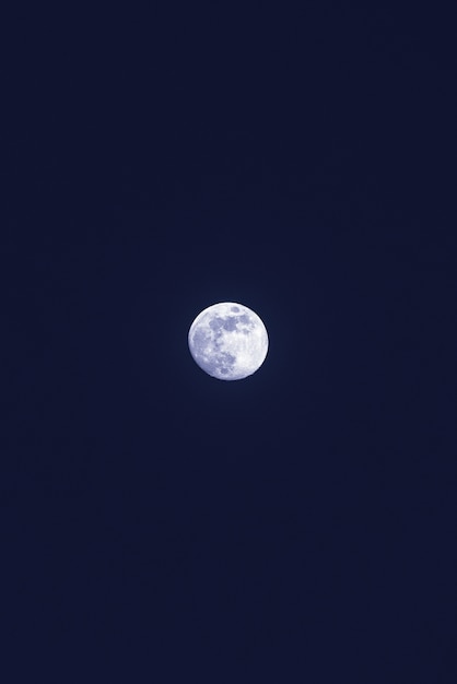 Beautiful lonely white moon in the dark blue sky | Free Photo