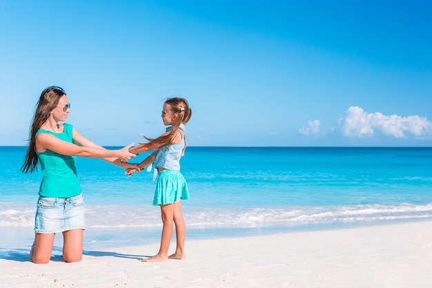 Premium Photo Beautiful Mother And Daughter At Caribbean Beach Enjoying Summer Vacation 