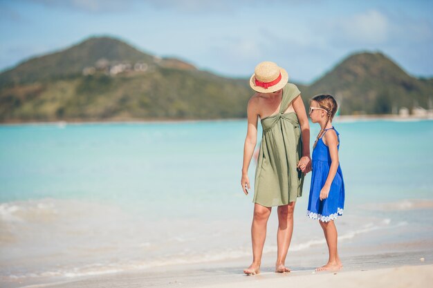 Premium Photo Beautiful Mother And Daughter At Caribbean Beach Enjoying Summer Vacation 2469