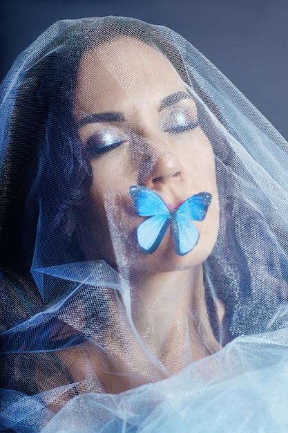 https://image.freepik.com/free-photo/beautiful-mysterious-woman-butterflies-blue-color_91497-377.jpg