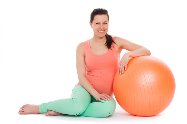 Beautiful pregnant woman with ball Free Photo