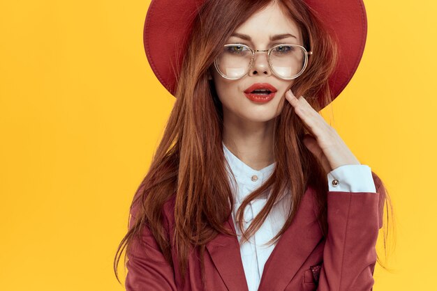 Premium Photo | Beautiful red-haired woman in a business suit and red ...