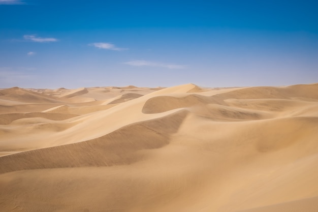 Free Photo | Beautiful scenery of sand dunes in a desert on a sunny day