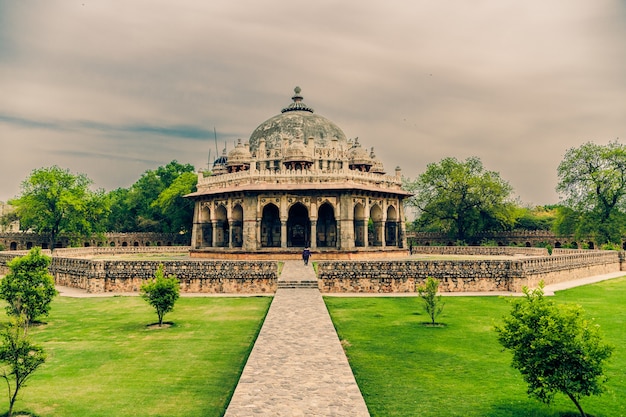 Beautiful shot of isa khan's tomb in delhi india under a cloudy sky Free Photo