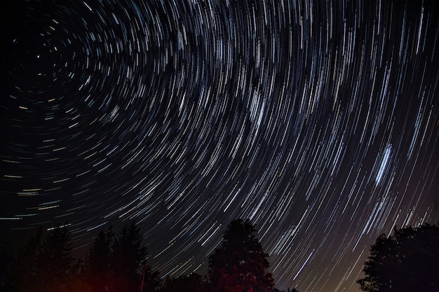 Beautiful shot of the night sky with breathtaking spinning stars | Free ...