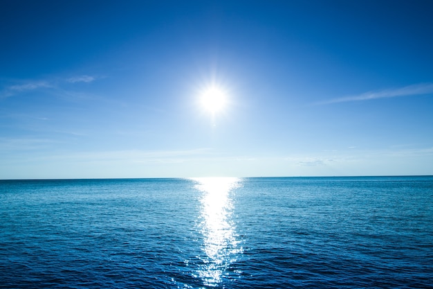 Premium Photo | Beautiful sky sun and blue ocean