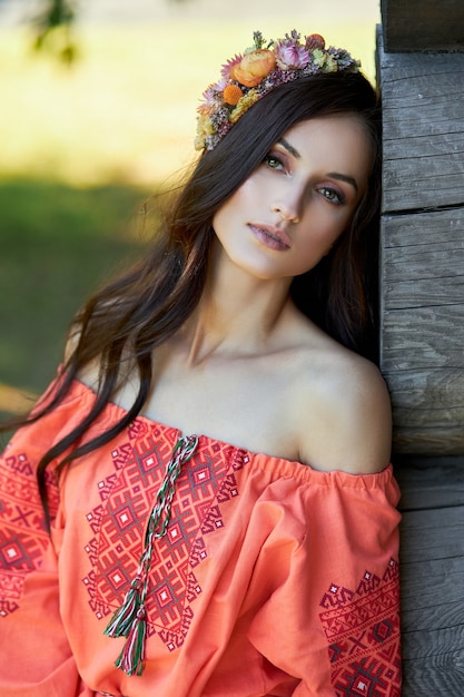 https://image.freepik.com/free-photo/beautiful-slavic-woman-orange-ethnic-dress-wreath-flowers-her-head-beautiful-natural-makeup_91497-5416.jpg