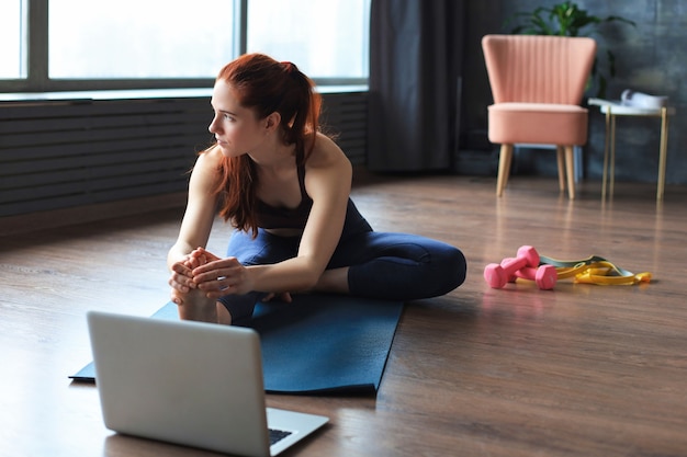 premium-photo-beautiful-slim-sporty-woman-is-stretching-while-sitting