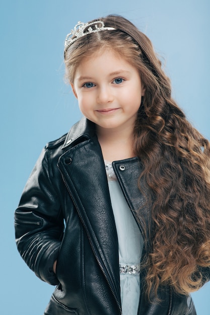 Premium Photo | Beautiful small child has blue eyes, long dark hair ...