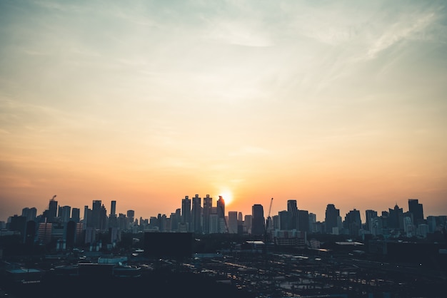 Premium Photo | Beautiful sunset cityscape and high-rise buildings in ...