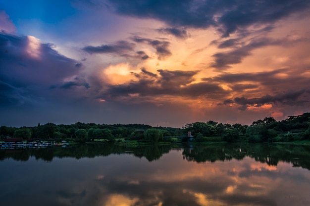 Free Photo | Beautiful sunset over the forest lake