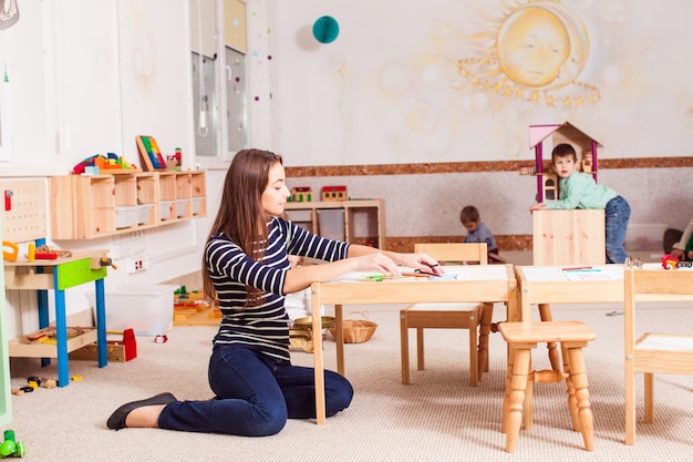 Premium Photo | Beautiful teacher in the kindergarten