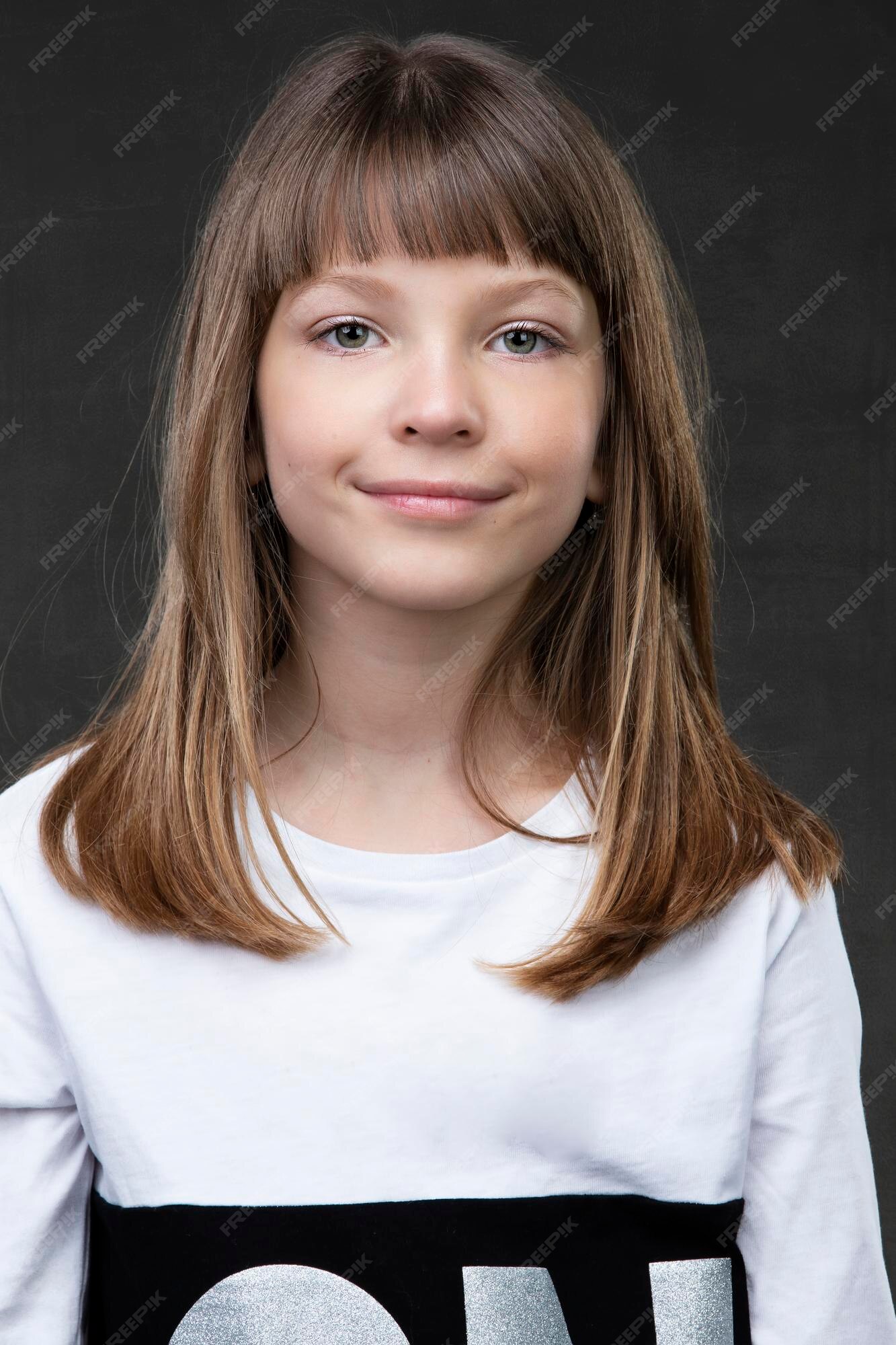 premium-photo-a-beautiful-ten-year-old-girl-is-looking-at-the-camera