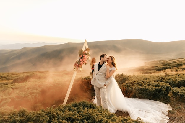 https://image.freepik.com/free-photo/beautiful-wedding-ceremony-mountains-wedding-couple-newlyweds-love-hug-smile-wedding-nature_411847-192.jpg