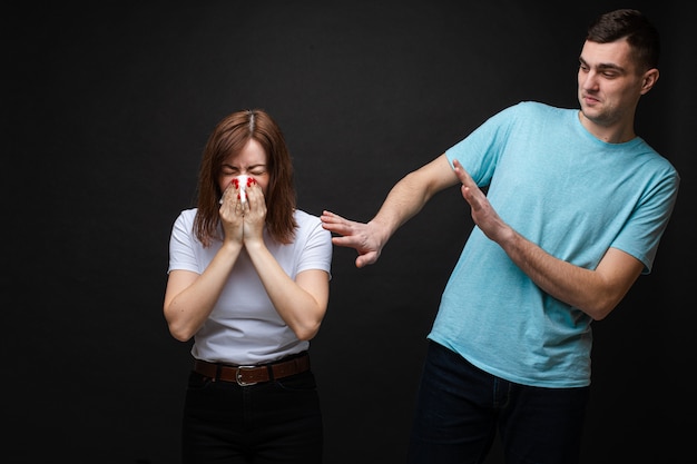 Premium Photo | Beautiful woman is sick and sneezes in napkin near her ...