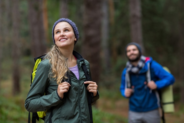 Premium Photo | Beautiful woman looking at nature while hiking in forest