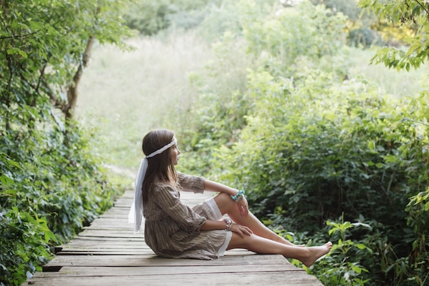 https://image.freepik.com/free-photo/beautiful-woman-old-wooden-bridge-forest_176873-1382.jpg