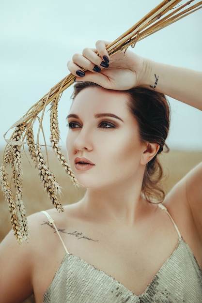 Premium Photo Beautiful Woman Posing In The Golden Wheat Field