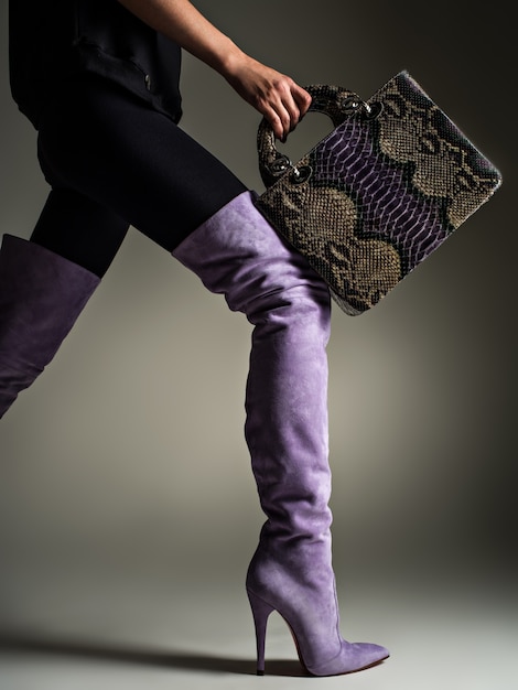 Free Photo Beautiful Woman In Purple High Boots Fashionable Girl Holds Stylish Violet Leather Bag Glamour Stylish Concept Art Model Walks After Shopping