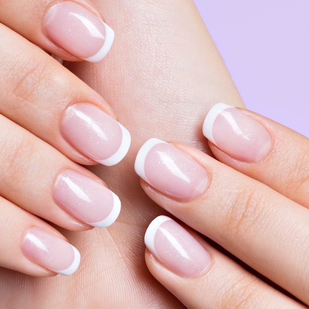 Free Photo | Beautiful woman's nails with beautiful french white manicure