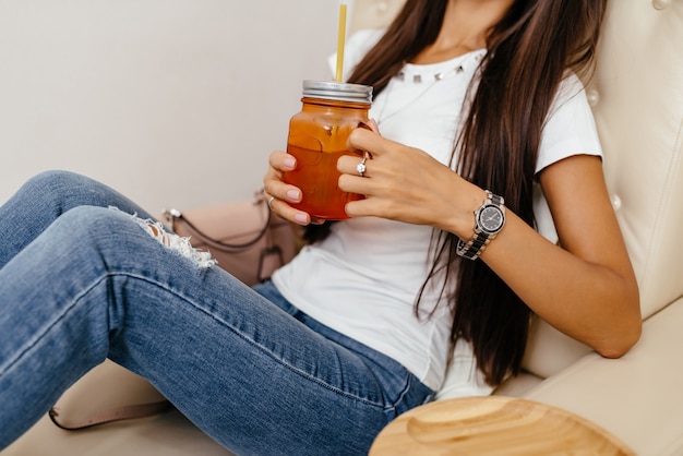 Premium Photo | Beautiful woman sitting and drinking tea