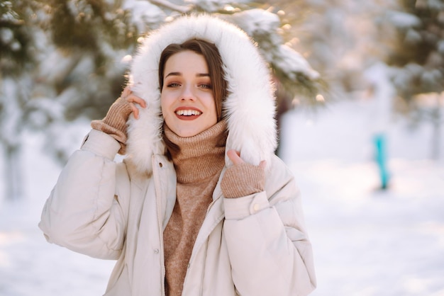 Premium Photo | Beautiful woman in a snowy park young lady walking in a ...