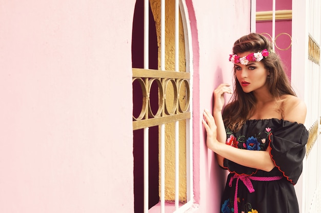 https://image.freepik.com/free-photo/beautiful-woman-wearing-traditional-mexican-dress-is-posing-beside-pink-wall_144962-10534.jpg