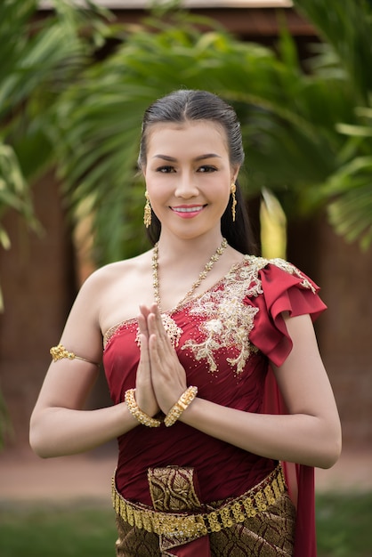 https://image.freepik.com/free-photo/beautiful-woman-wearing-typical-thai-dress_1150-5444.jpg