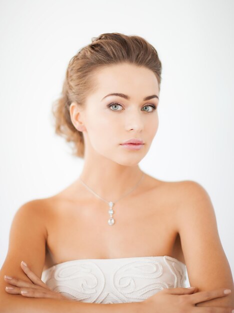 Premium Photo Beautiful Woman In White Dress With Diamond Necklace