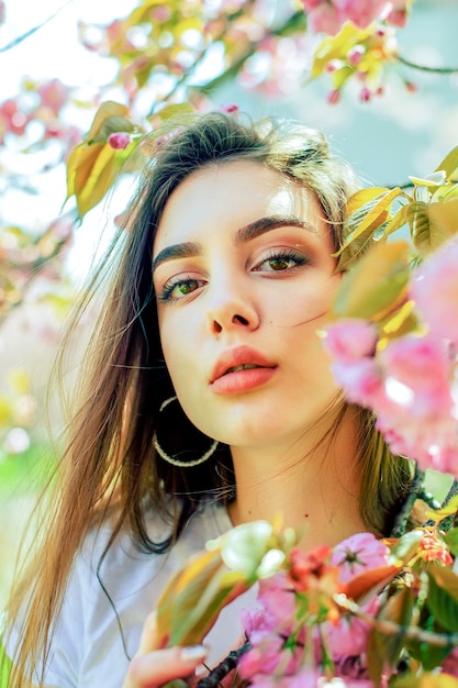 Premium Photo Beautiful Woman With Long Hair Enjoys The Beauty Of Spring