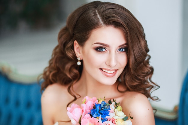 beautiful young bride with wedding makeup and hairstyle