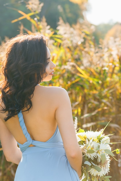 Premium Photo | Beautiful young bridesmaid with curly hair