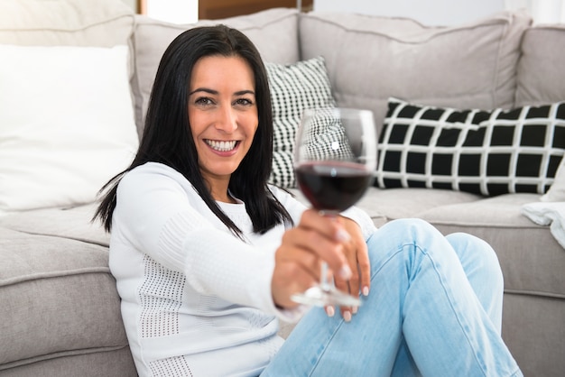 Premium Photo | Beautiful young girl holding a wine glass