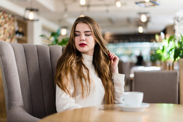 Premium Photo | Beautiful young girl with professional makeup and ...