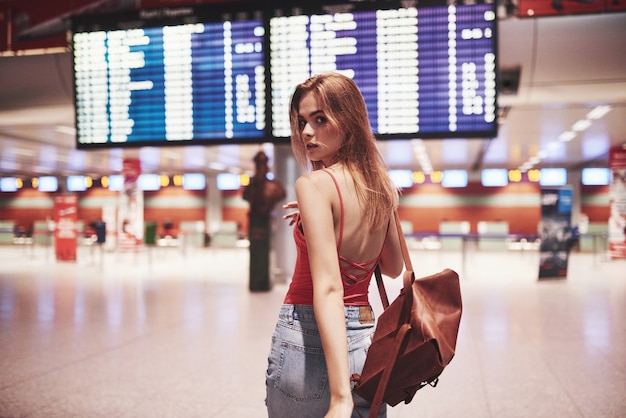 Premium Photo | Beautiful young tourist girl with backpack in ...