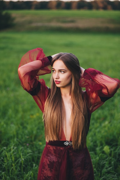 Premium Photo | A beautiful young woman in a bard dress is gazing on in ...